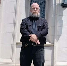 Minister Aaron J Wisti in front of Omaha's First Presbyterian Church in Midtown Omaha.